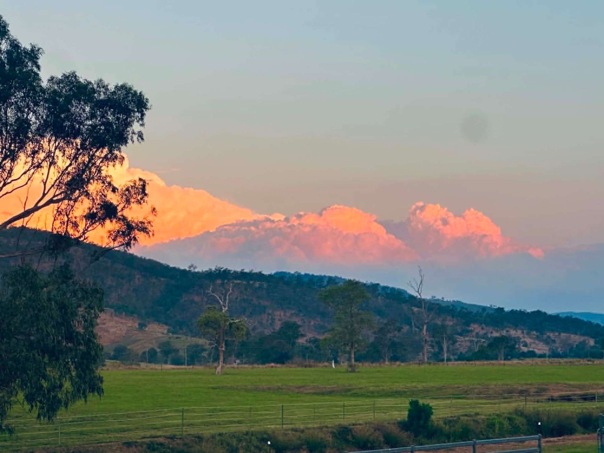 Pink sunset clouds over the hills beyond the sanctuary